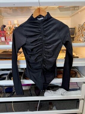 Good American black ruched bodysuit with long sleeves and high cowl neck